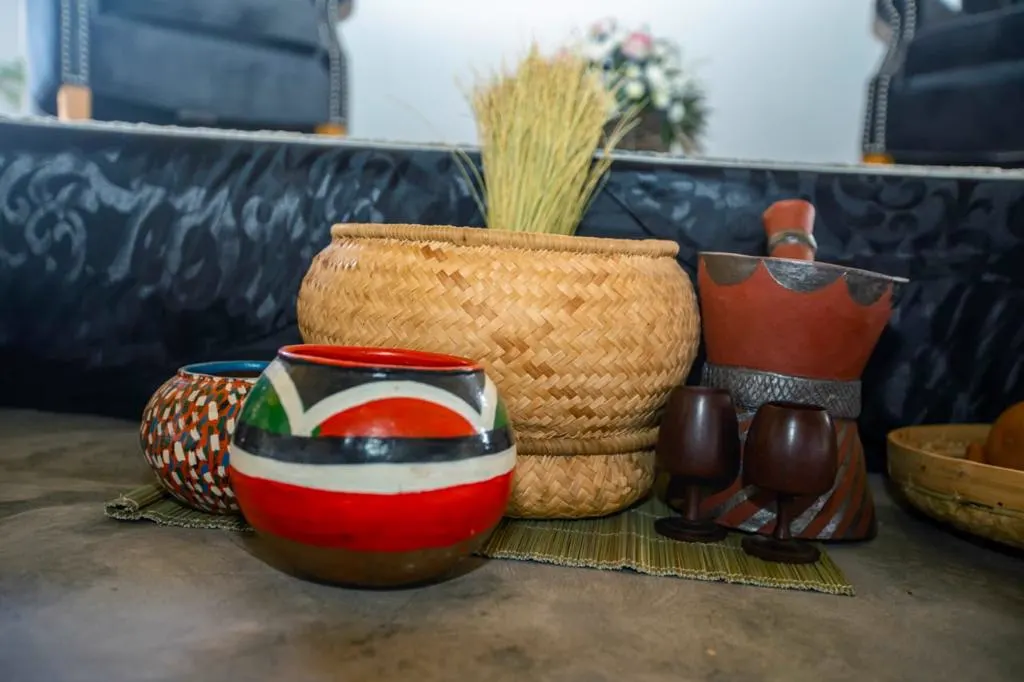 Traditional clay pots and woven baskets on display