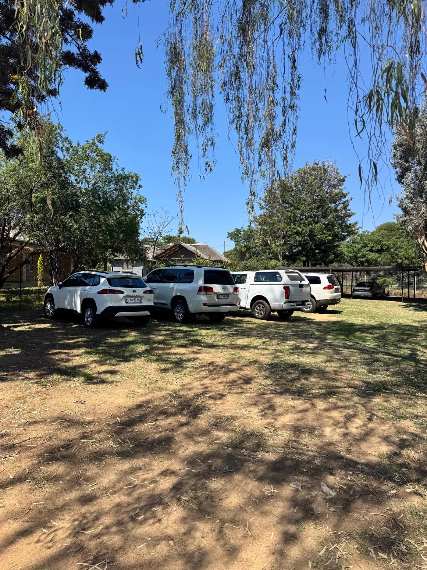 Shaded on-site parking under the trees