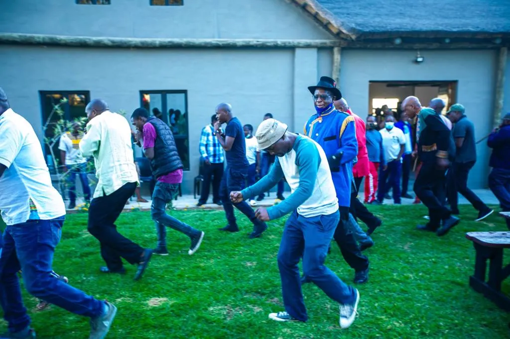 Guests dancing on the lawn at a celebration