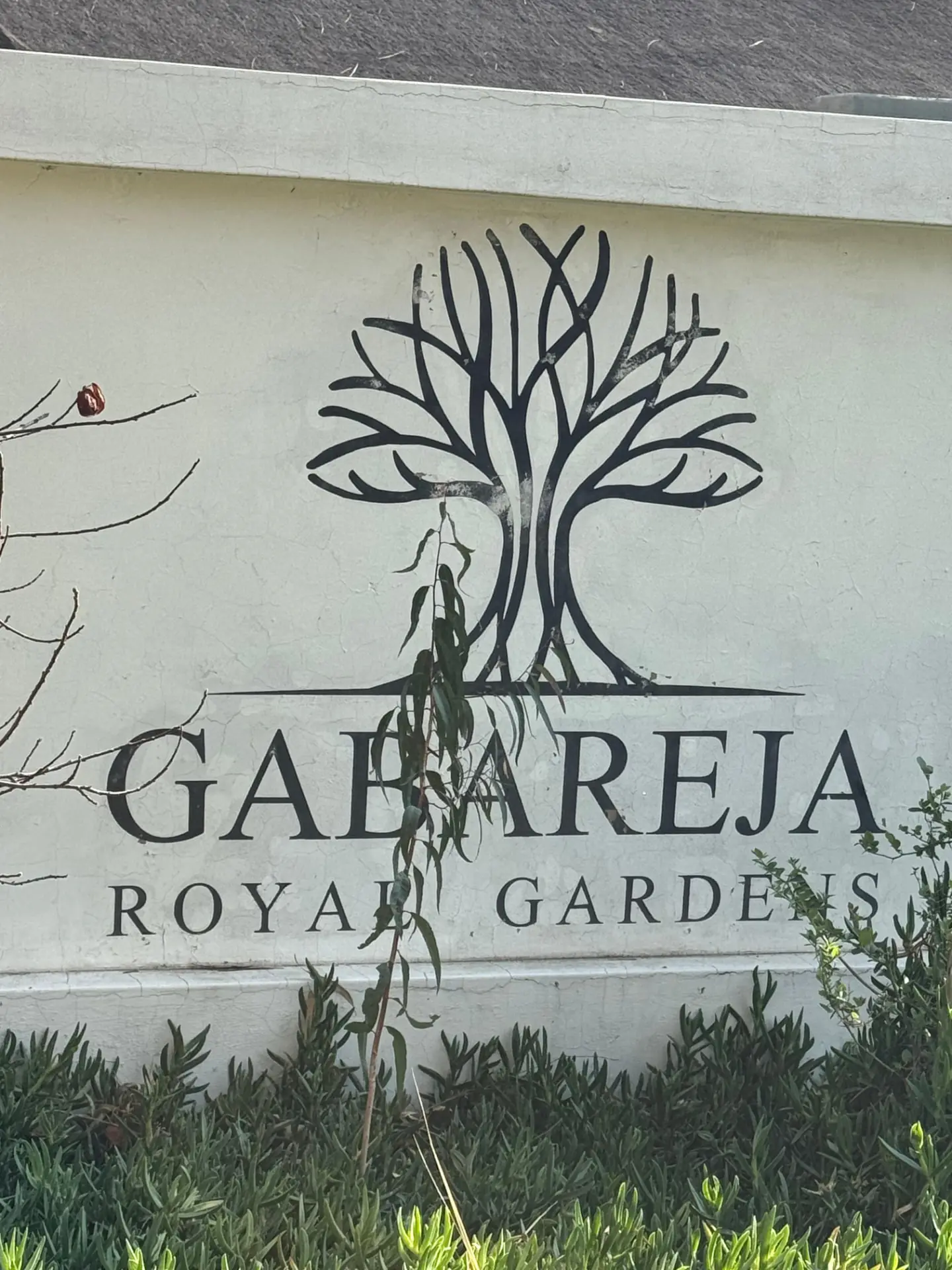 The Gabareja Royal Gardens tree emblem